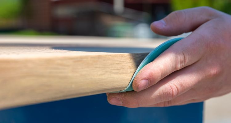 Sanding the wood surface